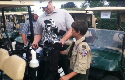5 Evan Williams from Troop 42 helping a participating golfer